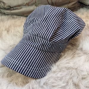 Dark blue and white striped conductor hat
